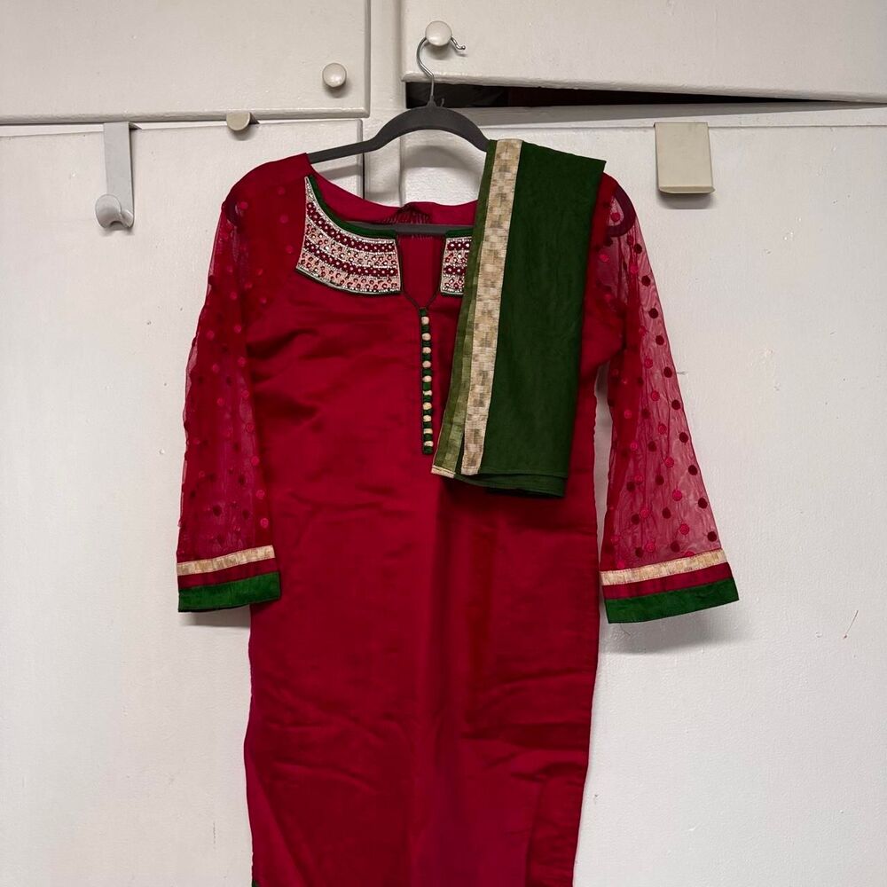 Red kurta with green and beige trim